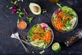 Vegan buddha bowl dinner food table. Healthy food. Healthy vegan lunch bowl. Fritter with lentils and radish, avocado, carrot sala Royalty Free Stock Photo