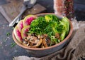 Vegan buddha bowl dinner food table. Healthy vegan lunch bowl. Grilled mushrooms, broccoli, radish salad