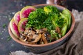 Vegan buddha bowl dinner food table. Healthy vegan lunch bowl. Grilled mushrooms, broccoli, radish salad Royalty Free Stock Photo