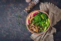 Vegan buddha bowl dinner food table. Healthy food. Healthy vegan lunch bowl. Grilled mushrooms, broccoli, radish salad. Flat lay. Royalty Free Stock Photo