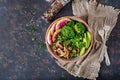 Vegan buddha bowl dinner food table. Healthy food. Healthy vegan lunch bowl. Grilled mushrooms, broccoli, radish salad. Flat lay. Royalty Free Stock Photo