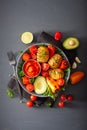 Vegan buddha bowl. healthy lunch bowl with hasselback potato, av