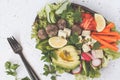 Vegan buddha bowl salad with vegetables, tofu, black beans meatballs and avocado. Healthy vegan food concept.