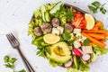 Vegan buddha bowl salad with vegetables, tofu, black beans meatballs and avocado. Healthy vegan food concept.