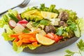 Vegan buddha bowl salad with vegetables, tofu, black beans meatballs and avocado. Healthy vegan food concept.