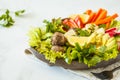 Vegan buddha bowl salad with vegetables, tofu, black beans meatballs and avocado. Healthy vegan food concept.