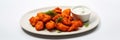 Vegan Buffalo Cauliflower Bites On White Round Plate On White Background