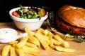 Vegan burger with salad, and french fries