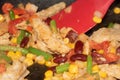 Vegan Chicken Vegetable Bean Stir Fry in Wok with Spatula