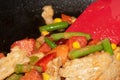Vegan Chicken Vegetable Bean Stir Fry in Wok with Spatula