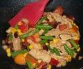 Vegan Chicken Vegetable Bean Stir Fry in Wok with Spatula