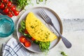 Vegan chickpea omelet with broccoli, tomatoes and seedlings, top view. Healthy vegan food concept Royalty Free Stock Photo