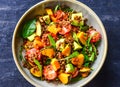 Mediterranean vegan chickpea salad with roasted pumpkins and pomegranate seeds