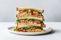 Vegan Chickpea Salad Sandwich On White Round Plate On White Background. Generative AI