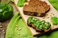 Vegan cilantro pine nuts pesto on a wooden background Royalty Free Stock Photo