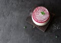 Vegan coconut mousse with berry in glass