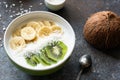 Vegan coconut smoothie bowl with banana and kiwi