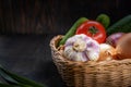 Vegan concept, healthy food, organic vegetables in a basket on a dark background, in a rustic style, the main object is Royalty Free Stock Photo