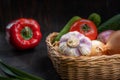 Vegan concept, healthy food, organic vegetables in a basket on a dark background, in a rustic style, the main object is Royalty Free Stock Photo