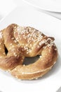 Vegan dairy-free organic german pretzel bread on white table
