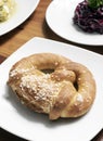 Vegan dairy-free organic german pretzel bread on wood table