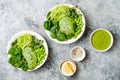 Vegan, detox Buddha bowl with avocado, spinach, micro greens, edamame beans, zucchini noodles and herb green dressing Royalty Free Stock Photo