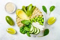 Vegan, detox green Buddha bowl recipe with quinoa, cucumber, broccoli, asparagus and sweet peas. Royalty Free Stock Photo