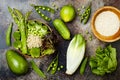 Vegan, detox green Buddha bowl recipe with quinoa, cucumber, broccoli, asparagus and sweet peas. Royalty Free Stock Photo