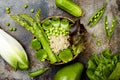 Vegan, detox green Buddha bowl recipe with quinoa, cucumber, broccoli, asparagus and sweet peas. Royalty Free Stock Photo