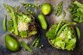 Vegan, detox green Buddha bowl recipe with quinoa, cucumber, broccoli, asparagus and sweet peas. Royalty Free Stock Photo