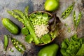 Vegan, detox green Buddha bowl recipe with quinoa, cucumber, broccoli, asparagus and sweet peas. Royalty Free Stock Photo