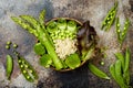 Vegan, detox green Buddha bowl recipe with quinoa, cucumber, broccoli, asparagus and sweet peas. Royalty Free Stock Photo