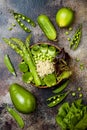 Vegan, detox green Buddha bowl recipe with quinoa, cucumber, broccoli, asparagus and sweet peas. Royalty Free Stock Photo