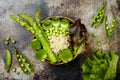 Vegan, detox green Buddha bowl recipe with quinoa, cucumber, broccoli, asparagus and sweet peas. Royalty Free Stock Photo