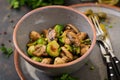 Vegan dish. Baked mushrooms with Brussels sprouts and herbs.