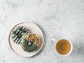 Vegan donuts topped spirulina glaze and tea Royalty Free Stock Photo