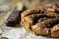 Vegan eggless whole wheat plum cake on parchment paper, knife Royalty Free Stock Photo