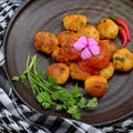 Vegan food, fried tofu ball cook with tomato sauce for vegetarian meal Royalty Free Stock Photo