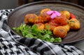 Vegan food, fried tofu ball cook with tomato sauce for vegetarian meal Royalty Free Stock Photo