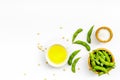 Vegan food with green soybeans or edamame and oil on white background top view copy space Royalty Free Stock Photo