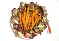 Vegan food with grilled carrots and bitter salad