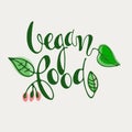 Vegan Food hand lettering decorated with leaves on white background. Icon, logo, banner, label, mark