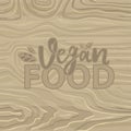 Vegan Food Lettering on Wooden Background. Vector Royalty Free Stock Photo