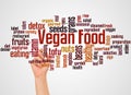 Vegan food word cloud and hand with marker concept Royalty Free Stock Photo