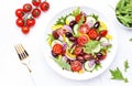 Vegan greek salad with kalamata olives, cherry tomato, yellow paprika, cucumber and red onion, healthy mediterranean diet food,