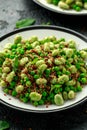 Vegan Green broad beans and quinoa salad with sweet peas and mint. Healthy food. Royalty Free Stock Photo