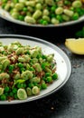 Vegan Green broad beans and quinoa salad with sweet peas and mint. Healthy food. Royalty Free Stock Photo