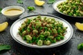 Vegan Green broad beans and quinoa salad with sweet peas and mint. Healthy food. Royalty Free Stock Photo