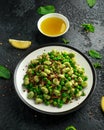 Vegan Green broad beans and quinoa salad with sweet peas and mint. Healthy food. Royalty Free Stock Photo