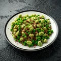 Vegan Green broad beans and quinoa salad with sweet peas and mint. Healthy food. Royalty Free Stock Photo